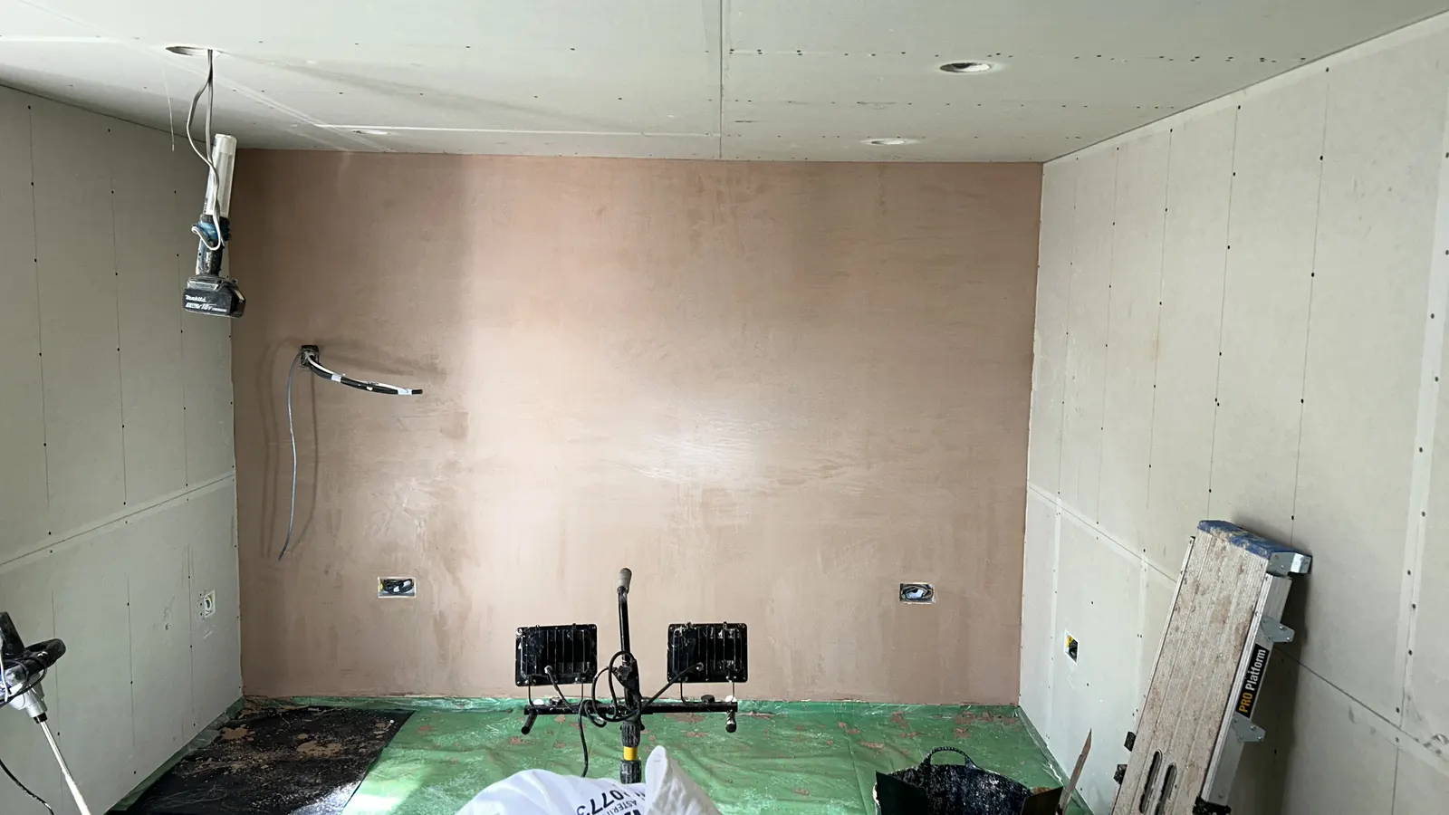 Garage conversion wall freshly plasterboarded and skimmed ready for decoration