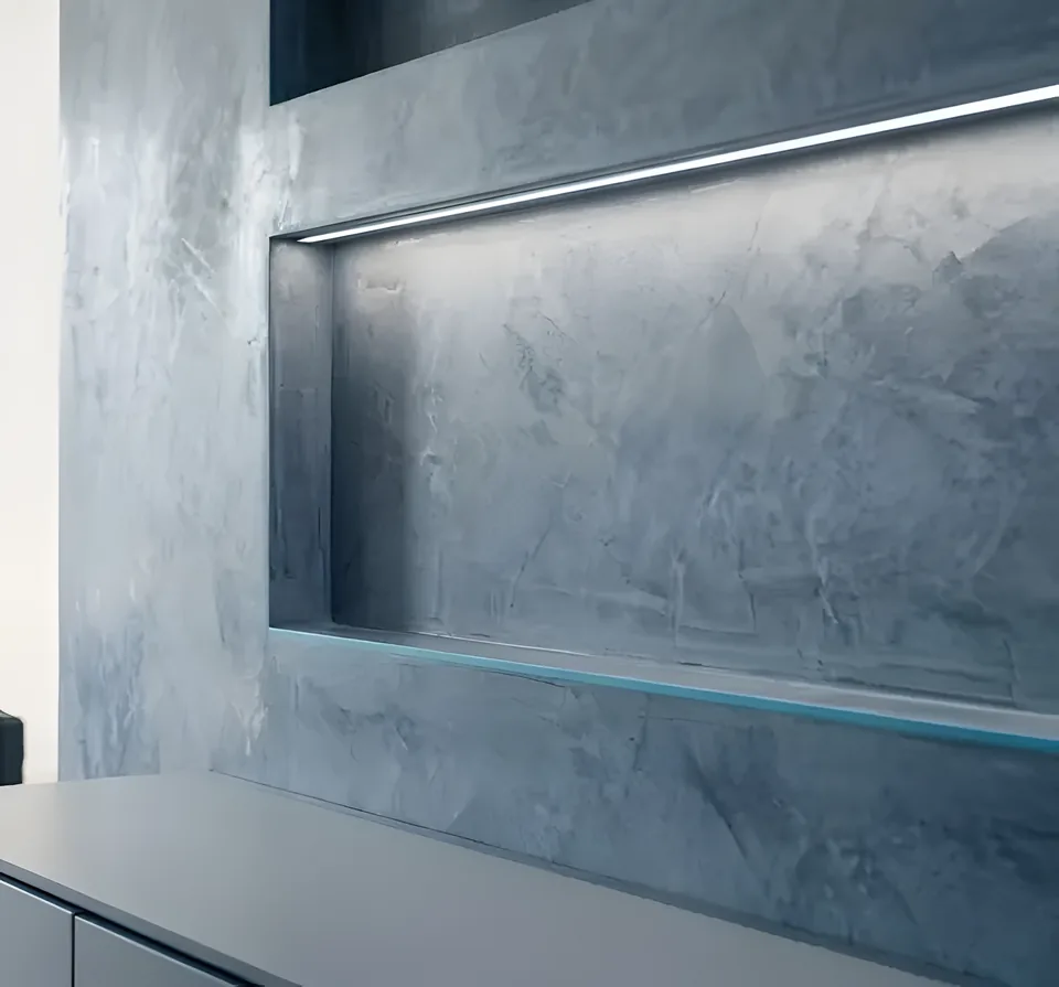 Metallic Venetian plaster wall finish with built-in shelf lighting